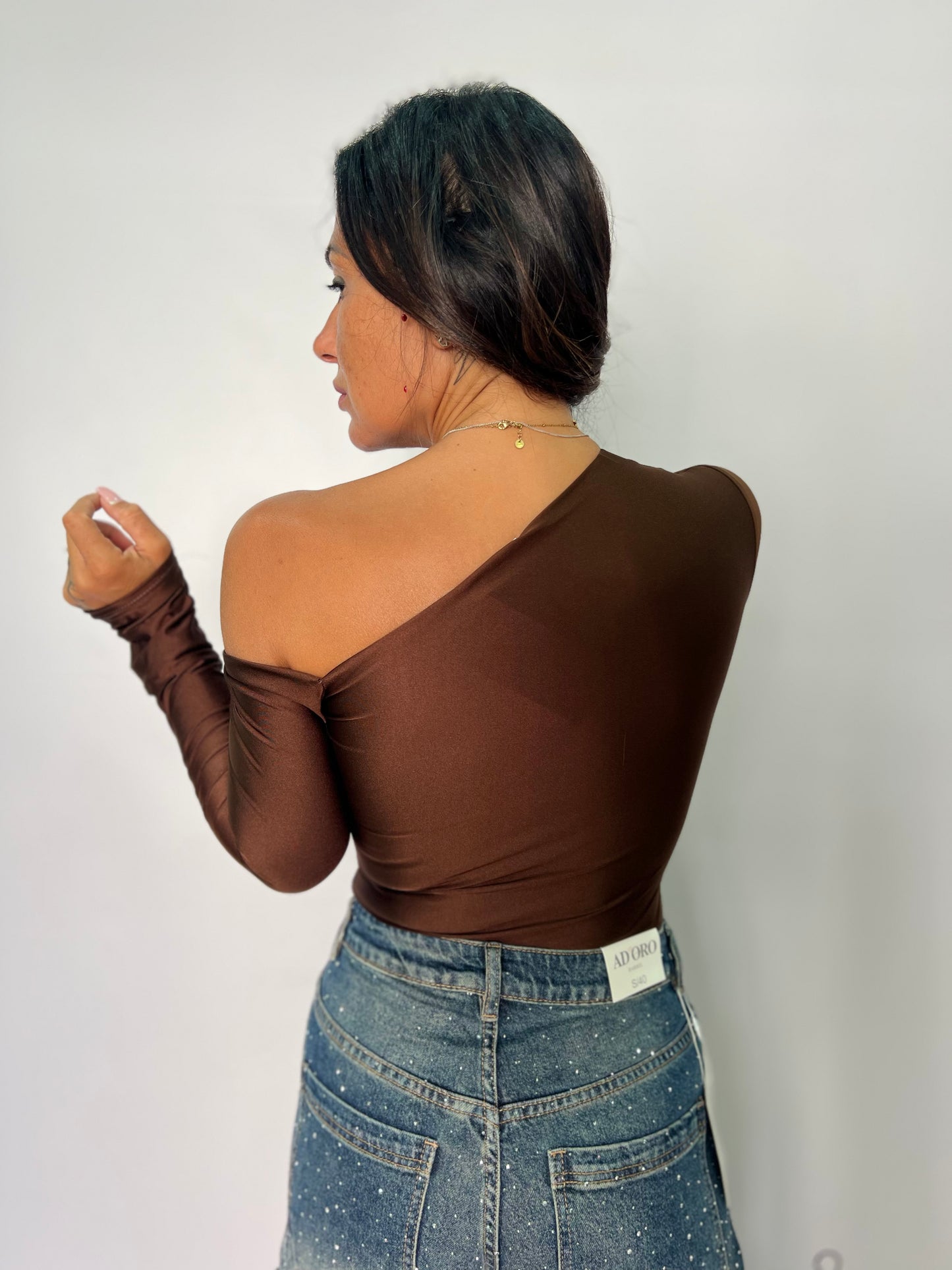 Body kim con accessorio in oro