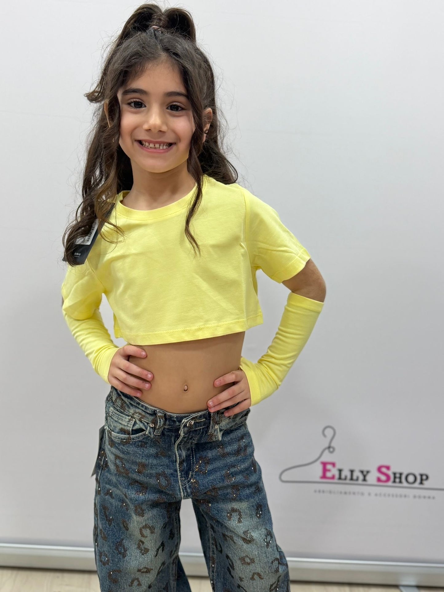 Top crop bambina con manicotti